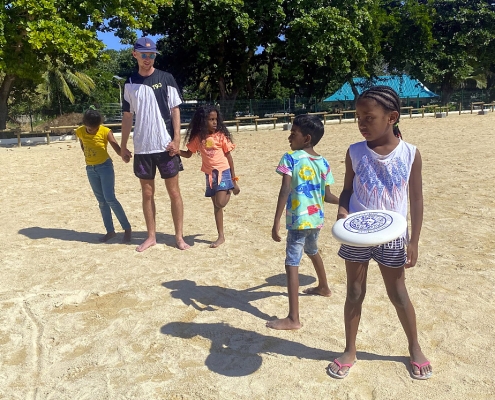 Children learning ultimate frisbee